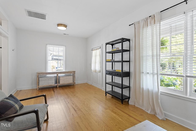 living area with light hardwood / wood-style floors