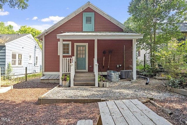 rear view of house with central air condition unit