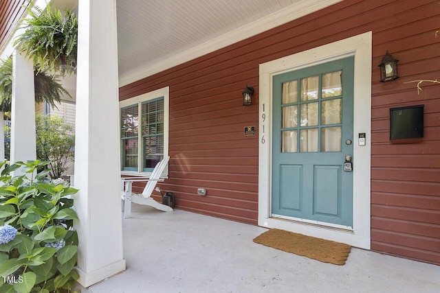 entrance to property with a porch