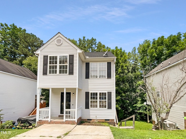 view of front property with a porch and a front yard