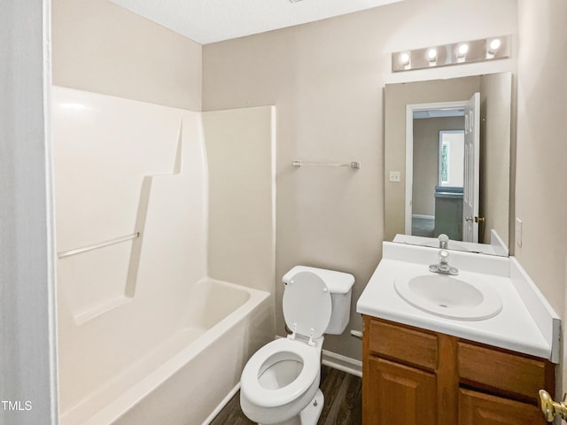 full bathroom with shower / bath combination, vanity, a textured ceiling, wood-type flooring, and toilet