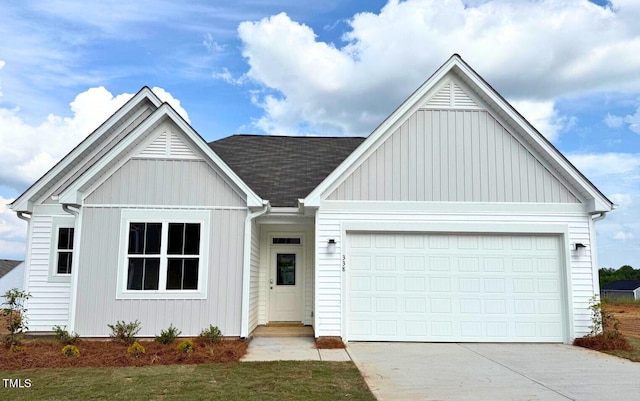 338 Tormore Dr, Home, Sanford, NC 27330 - view of front of home featuring concrete driveway, a garage, roof with shingles, and board and batten siding