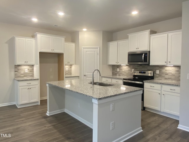 338 Tormore Dr, Home, Sanford, NC 27330 - kitchen with appliances with stainless steel finishes, a sink, decorative backsplash, white cabinetry, and dark wood-type flooring