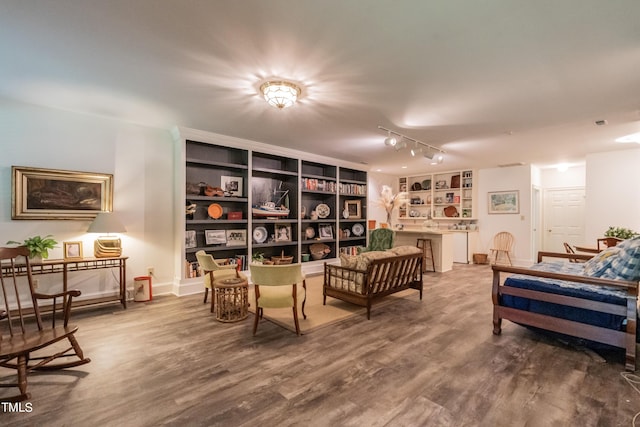 sitting room featuring wood-type flooring and track lighting