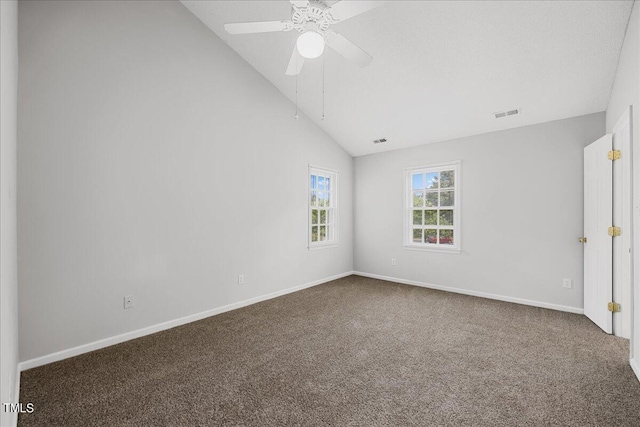 unfurnished room with baseboards, visible vents, a ceiling fan, vaulted ceiling, and carpet flooring