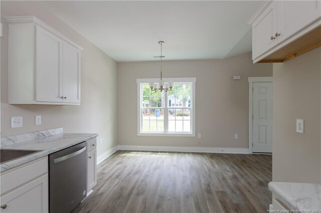 kitchen with white cabinetry, stainless steel dishwasher, a chandelier, light wood-type flooring, and light stone countertops