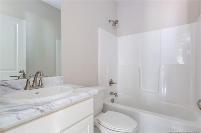 bathroom featuring shower / bath combination, vanity, and toilet