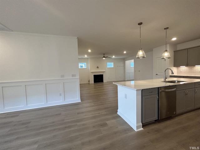 154 Swain St, Clayton, NC 27527 - kitchen featuring dark hardwood / wood-style flooring, a kitchen island with sink, sink, dishwasher, and gray cabinets