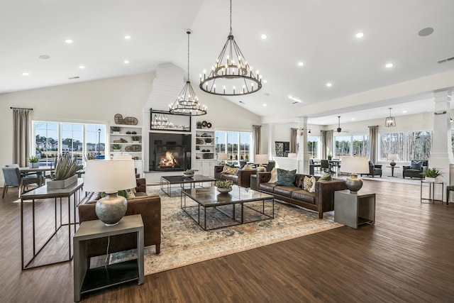 154 Swain St, Clayton, NC 27527 - living room featuring plenty of natural light, a fireplace, high vaulted ceiling, and dark hardwood / wood-style floors