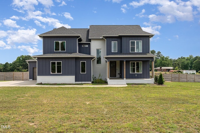 view of front facade featuring covered porch and a front lawn