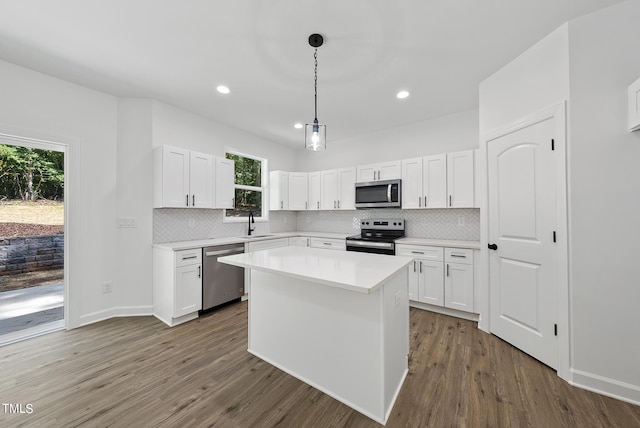 kitchen featuring white cabinetry, appliances with stainless steel finishes, and a kitchen island