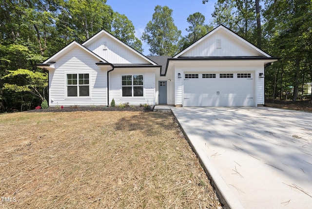 ranch-style house with a garage and a front lawn