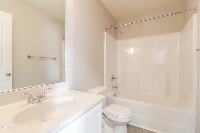 full bathroom featuring vanity, wood-type flooring, shower / tub combination, and toilet