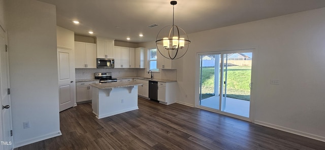466 Saint Clair Dr, Fuquay Varina, NC 27526 - kitchen with stainless steel appliances, a sink, tasteful backsplash, white cabinets, and recessed lighting