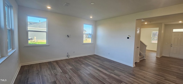 empty room featuring dark wood-type flooring