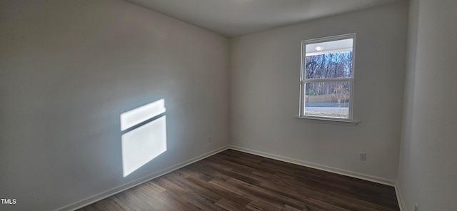 unfurnished room featuring dark hardwood / wood-style flooring