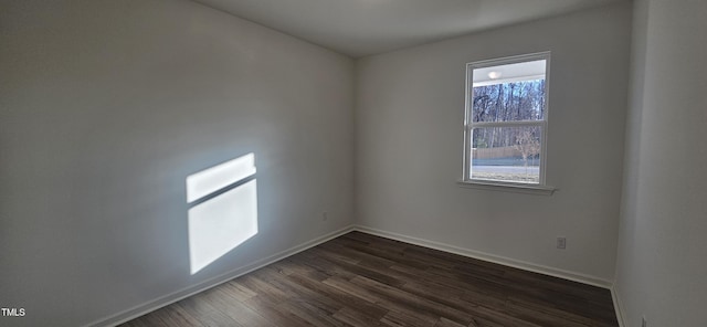 466 Saint Clair Dr, Fuquay Varina, NC 27526 - unfurnished room with dark wood-style floors and baseboards