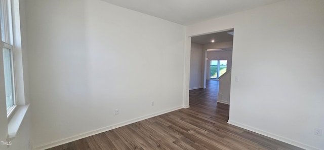 spare room featuring dark hardwood / wood-style flooring