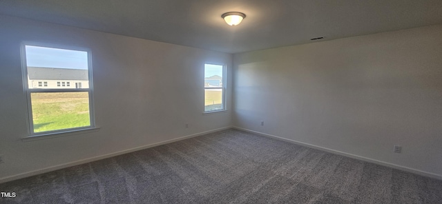 466 Saint Clair Dr, Fuquay Varina, NC 27526 - spare room with plenty of natural light, carpet flooring, and baseboards