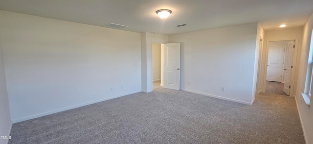 empty room with carpet flooring