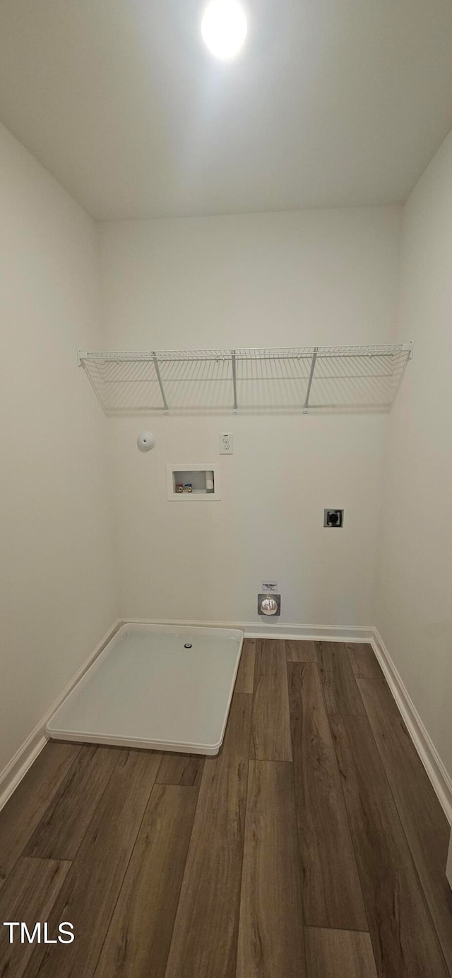 laundry room with washer hookup, dark hardwood / wood-style flooring, gas dryer hookup, and electric dryer hookup