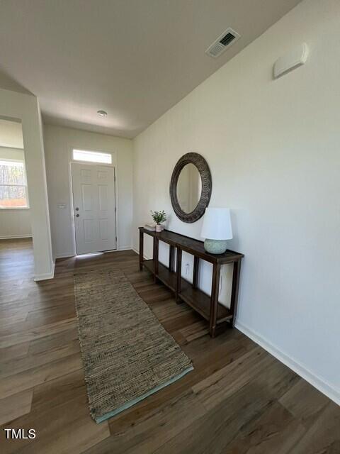466 Saint Clair Dr, Fuquay Varina, NC 27526 - entrance foyer with baseboards and dark wood finished floors