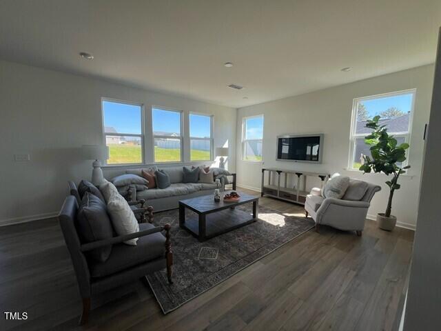 466 Saint Clair Dr, Fuquay Varina, NC 27526 - living area featuring wood finished floors and baseboards