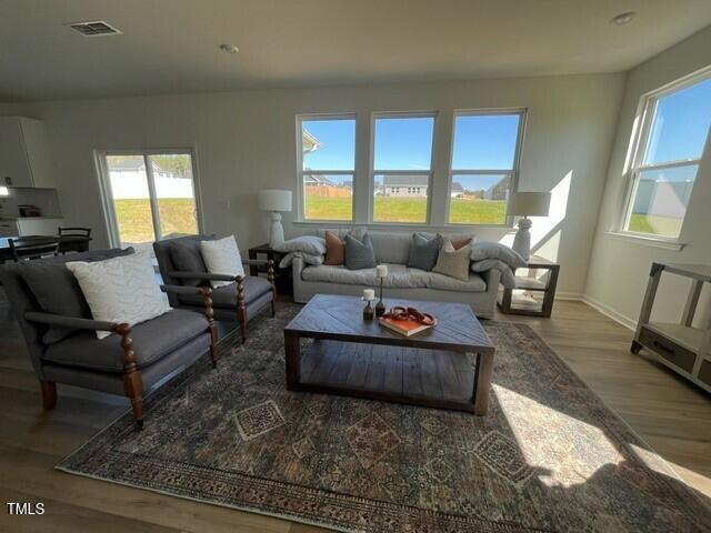 466 Saint Clair Dr, Fuquay Varina, NC 27526 - living area with wood finished floors and baseboards