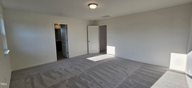 unfurnished bedroom with visible vents, baseboards, and carpet flooring