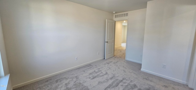 unfurnished bedroom with baseboards, visible vents, and carpet flooring