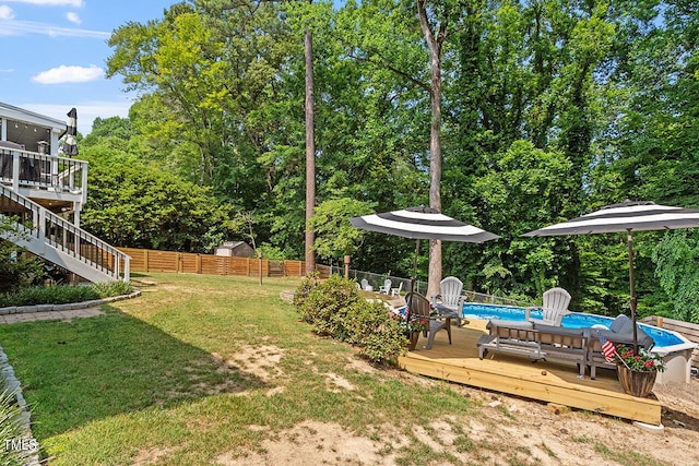 view of yard featuring a swimming pool side deck