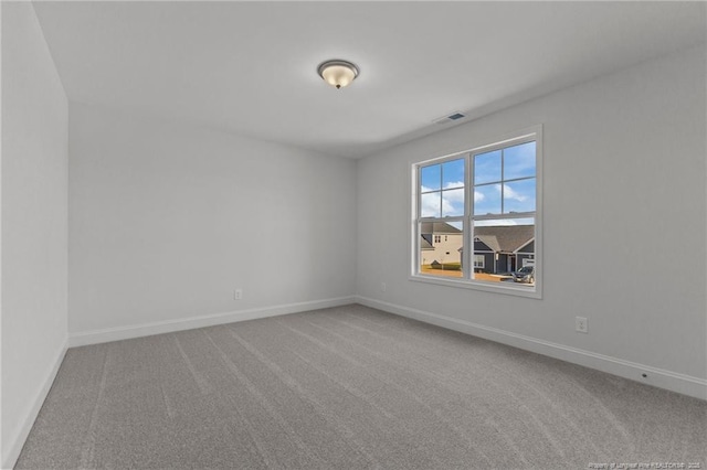 empty room featuring carpet flooring