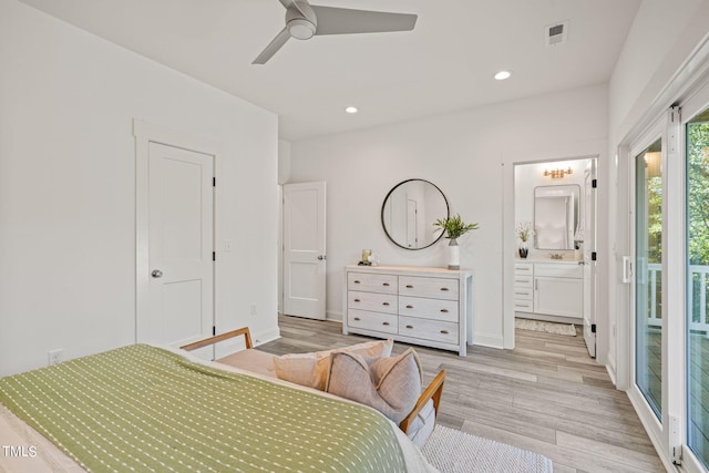 bedroom featuring ceiling fan, ensuite bath, light hardwood / wood-style flooring, and access to outside