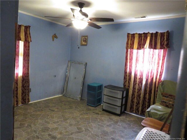 bedroom with crown molding and ceiling fan