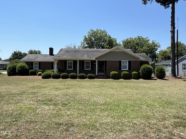 ranch-style home with a front yard