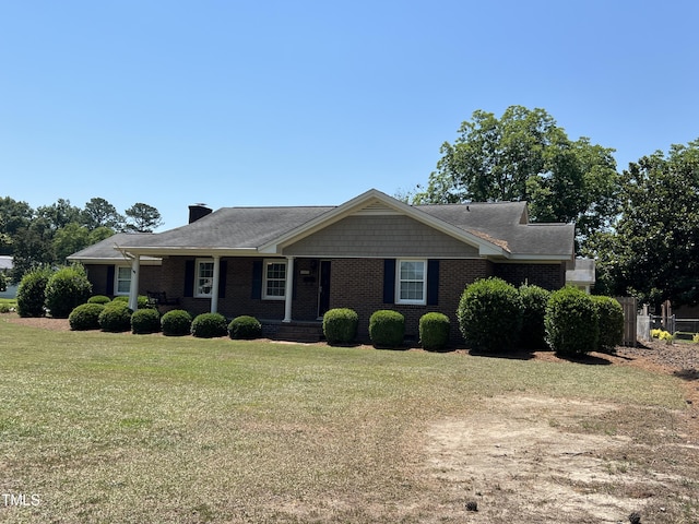 ranch-style home featuring a front lawn