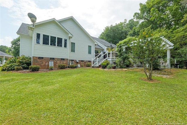 rear view of house with a lawn