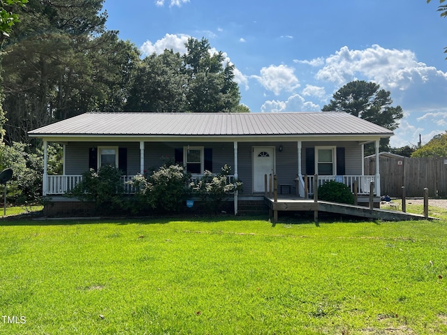 single story home featuring a front lawn and a porch