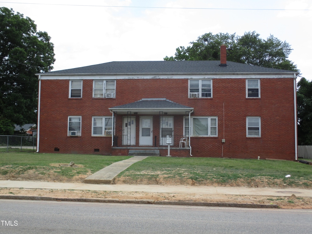 view of front of house featuring a front yard and a porch