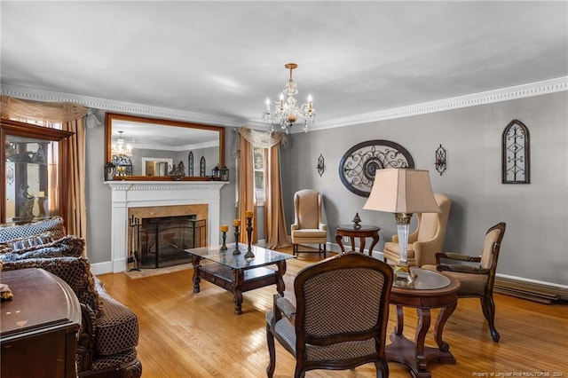 living room with light hardwood / wood-style flooring, crown molding, and a notable chandelier