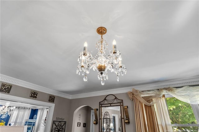 interior details featuring a notable chandelier and ornamental molding