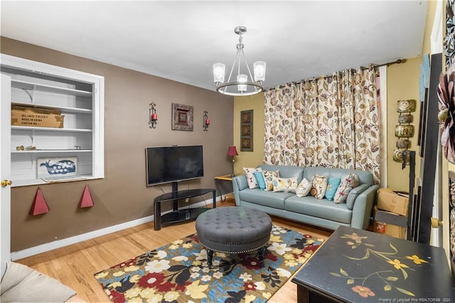 living room featuring hardwood / wood-style floors and a chandelier