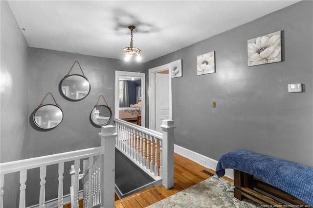 interior space featuring an inviting chandelier and hardwood / wood-style flooring