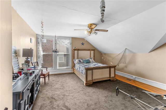 bedroom with carpet, ceiling fan, and lofted ceiling