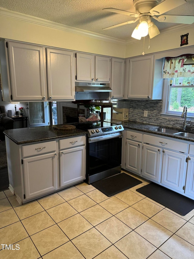 kitchen featuring electric range, ceiling fan, light tile floors, and crown molding