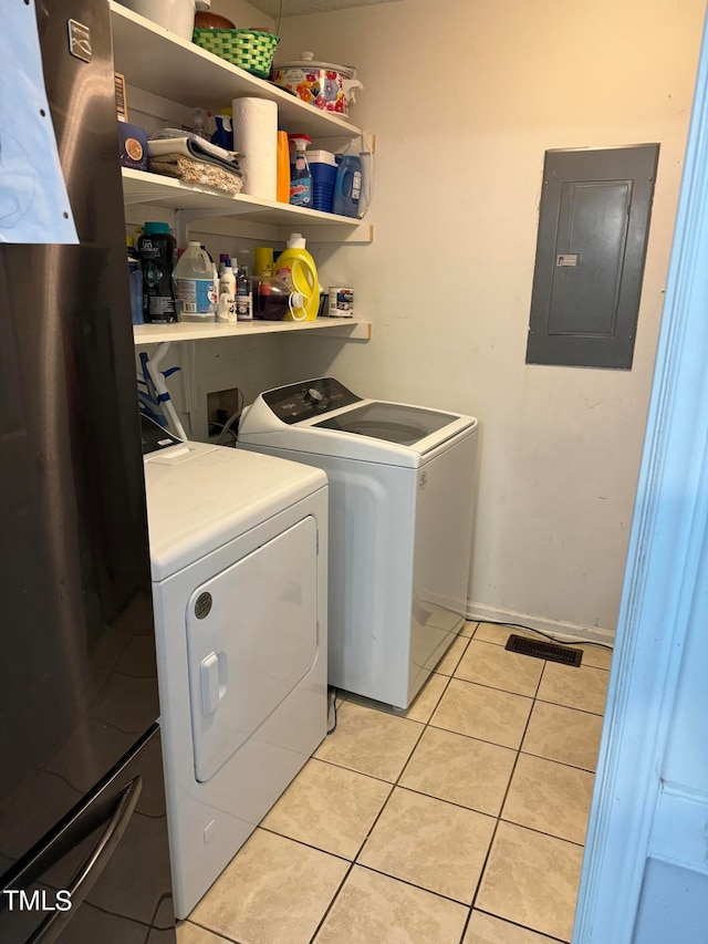 laundry room with independent washer and dryer, light tile flooring, and washer hookup