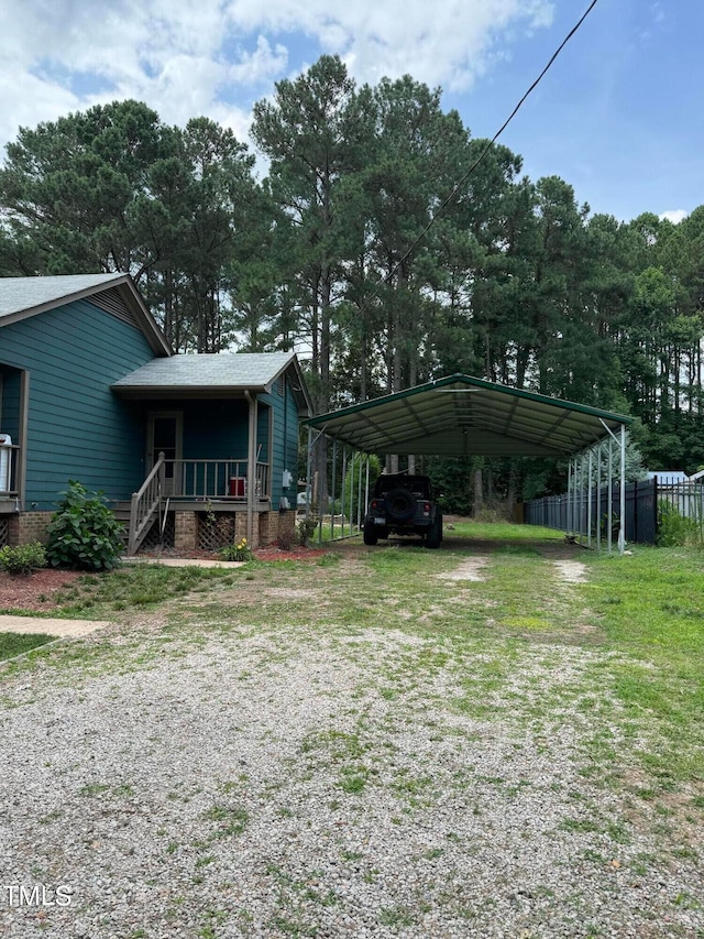 view of front of home featuring a carport and a porch