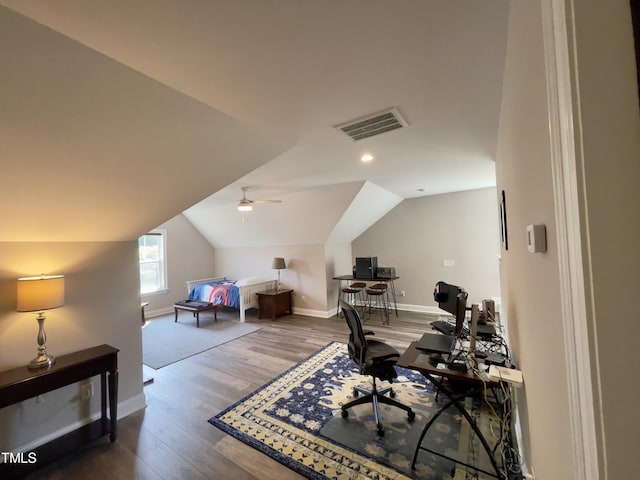 home office with hardwood / wood-style flooring, vaulted ceiling, and ceiling fan