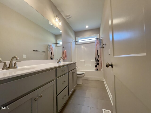 full bathroom featuring vanity, toilet, and shower / bath combo with shower curtain