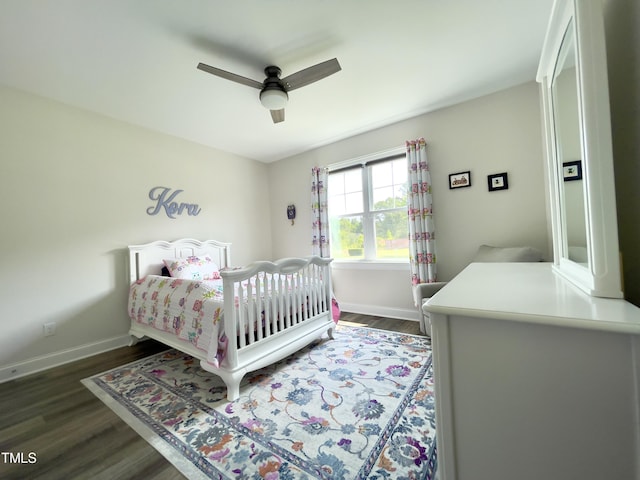 bedroom with dark hardwood / wood-style floors and ceiling fan